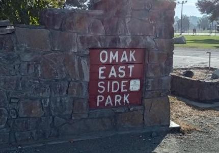 A sign that reads Eastside Park at the entrance of the park.