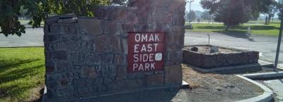 A sign that reads Eastside Park at the entrance of the park.
